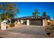 House exterior with a two-car garage and nicely landscaped front yard at 10601 N 26Th Pl, Phoenix, AZ 85028