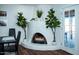 Whitewashed fireplace in dining room with adjacent door at 10601 N 26Th Pl, Phoenix, AZ 85028