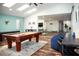 Spacious game room with pool table and natural light at 10601 N 26Th Pl, Phoenix, AZ 85028