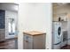 Bright laundry room with washer, dryer, and ample storage at 10601 N 26Th Pl, Phoenix, AZ 85028