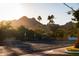 Residential street view showcasing the surrounding neighborhood and mountains at 10601 N 26Th Pl, Phoenix, AZ 85028