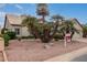 Landscaped front yard with palm trees and desert landscaping at 10609 E Cedar Waxwing Dr, Sun Lakes, AZ 85248