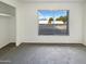 Bedroom with large window and mirrored closet at 11003 N 48Th Ave, Glendale, AZ 85304