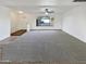 Bright living room with large window and carpeted floors at 11003 N 48Th Ave, Glendale, AZ 85304