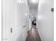 Bright hallway with wood-look floors and access to bedrooms at 1265 S Aaron -- # 359, Mesa, AZ 85209