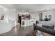 Open kitchen with dark wood cabinets, black appliances, and breakfast bar at 1265 S Aaron -- # 359, Mesa, AZ 85209