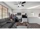 Comfortable living room featuring a gray sofa, coffee table, and ceiling fan at 1265 S Aaron -- # 359, Mesa, AZ 85209