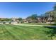 Community playground and shaded seating area at 1265 S Aaron -- # 359, Mesa, AZ 85209