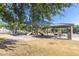 Community playground with shaded seating area at 1265 S Aaron -- # 359, Mesa, AZ 85209