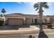 Single-story home with a two-car garage and desert landscaping at 13709 W Via Tercero --, Sun City West, AZ 85375