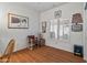 Home office with wood floors, a desk, and built-in shelving at 13709 W Via Tercero --, Sun City West, AZ 85375