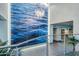 Elegant lobby with a stunning water-themed wall art piece and modern chandelier at 140 E Rio Salado Pkwy # 306, Tempe, AZ 85281