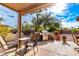 Relaxing patio with built-in grill, seating area, and desert landscaping at 16057 W Desert Winds Dr, Surprise, AZ 85374