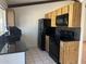 Kitchen with granite countertops and black appliances at 1770 E Sandra Ter, Phoenix, AZ 85022