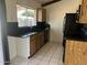 Kitchen with granite countertops and wood cabinets at 1770 E Sandra Ter, Phoenix, AZ 85022