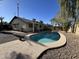 Inviting kidney shaped pool in backyard with surrounding landscaping at 1770 E Sandra Ter, Phoenix, AZ 85022