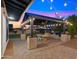 Covered patio with string lights, grill, and outdoor dining area at 17870 E Appaloosa Dr, Queen Creek, AZ 85142