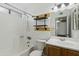 Clean bathroom with a tub, floating shelves, and a vanity at 19601 N 7Th St # 2026, Phoenix, AZ 85024