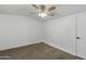 Simple bedroom with carpeted floor and ceiling fan at 19601 N 7Th St # 2026, Phoenix, AZ 85024