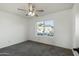 Spacious bedroom with gray carpet and a ceiling fan at 19601 N 7Th St # 2026, Phoenix, AZ 85024