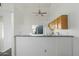 Kitchen area with wood cabinets and a breakfast bar at 19601 N 7Th St # 2026, Phoenix, AZ 85024