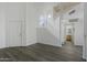 Open living area with laminate floors and staircase to loft at 19601 N 7Th St # 2026, Phoenix, AZ 85024