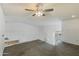 Open loft area with carpeted flooring and ceiling fan at 19601 N 7Th St # 2026, Phoenix, AZ 85024