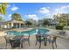 Community pool with patio furniture and surrounding landscape at 19601 N 7Th St # 2026, Phoenix, AZ 85024