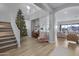 Stunning staircase leading to an open loft area with a view to the living room at 22911 E Thornton Rd, Queen Creek, AZ 85142