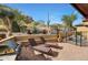 Private backyard oasis with a pool and lounge chairs at 27440 N Alma School Pkwy # 38-5, Scottsdale, AZ 85262