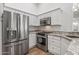 Stainless steel appliances and granite countertops in this updated kitchen at 4020 N 151St Dr, Goodyear, AZ 85395