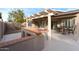 Outdoor patio area with a built-in bar and seating at 4020 N 151St Dr, Goodyear, AZ 85395