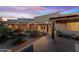 Spacious courtyard with seating area, native plants, and tile patio at 40920 N 254Th Ave, Morristown, AZ 85342