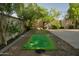 Backyard with putting green and basketball court at 4528 E Hobart St, Mesa, AZ 85205