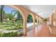 Covered patio overlooking a sparkling pool and lush landscaping at 4528 E Hobart St, Mesa, AZ 85205
