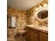 Bathroom with a tiled shower and stone vanity at 4528 E Hobart St, Mesa, AZ 85205