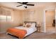 Bright bedroom with a comfy bed and neutral color palette at 4528 E Hobart St, Mesa, AZ 85205