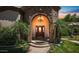 Grand entryway with an arched doorway and a stunning chandelier at 4528 E Hobart St, Mesa, AZ 85205