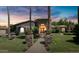 Elegant home exterior at dusk, showcasing stone and landscaping at 4528 E Hobart St, Mesa, AZ 85205