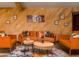 Comfortable living room with orange sofas and wooden coffee tables at 4528 E Hobart St, Mesa, AZ 85205