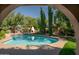 Inviting kidney shaped pool with a large backyard at 4528 E Hobart St, Mesa, AZ 85205