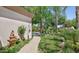 Landscaped side yard with walkway and fountain at 4528 E Hobart St, Mesa, AZ 85205