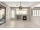 Living room with fireplace and sliding glass doors leading to patio at 5246 E Estevan Rd, Phoenix, AZ 85054