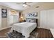 Bedroom with vaulted ceiling and large window at 8816 W Topeka Dr, Peoria, AZ 85382