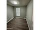 Small bedroom with wood-look floors and window blinds at 9431 E Coralbell Ave # 32, Mesa, AZ 85208