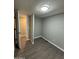 Bedroom with wood-look floors and access to bathroom at 9431 E Coralbell Ave # 32, Mesa, AZ 85208