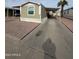 Mobile home with carport and paved driveway at 9431 E Coralbell Ave # 32, Mesa, AZ 85208