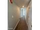 Bright hallway with light grey walls and wood-look flooring at 9431 E Coralbell Ave # 32, Mesa, AZ 85208