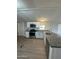 Modern kitchen with white cabinets and granite countertops at 9431 E Coralbell Ave # 32, Mesa, AZ 85208