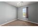 Bedroom with chandelier and window at 1007 E Sunland Ave, Phoenix, AZ 85040